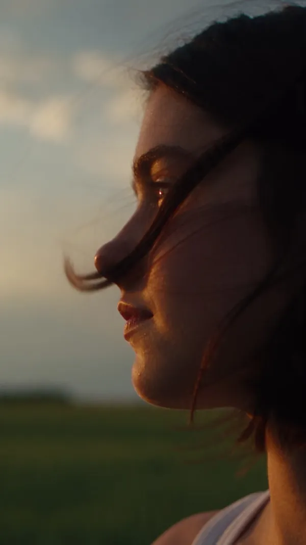Summer Short: Young Woman in a Green Meadow at…